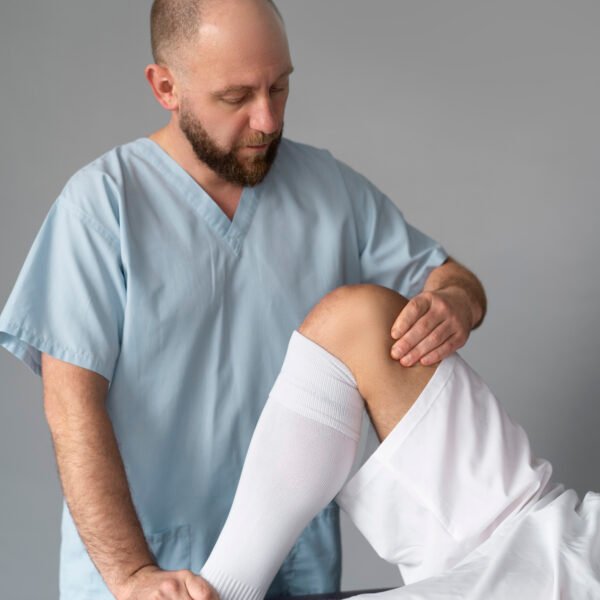 Front view doctor helping patient 600x600